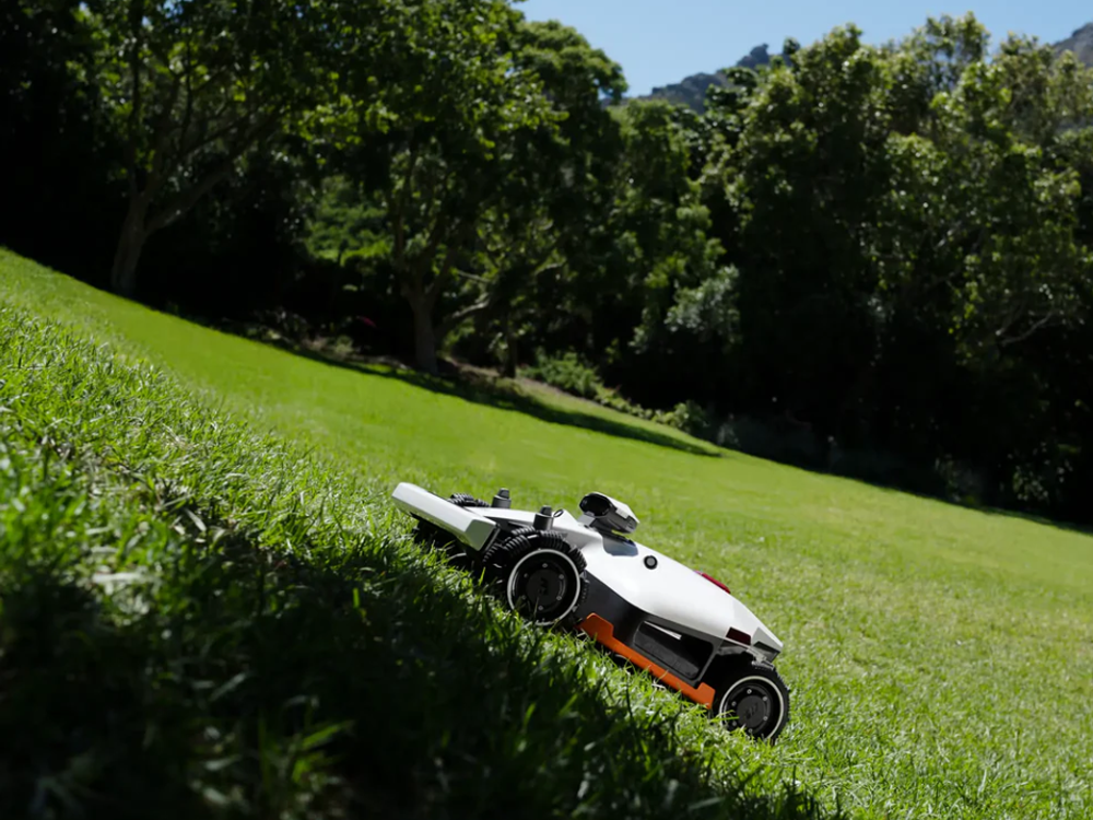 Luba 2X robot lawn mower cutting a large backyard lawn with dual 400 mm discs