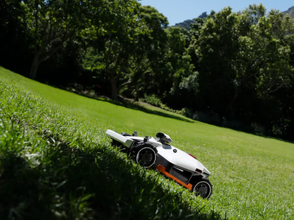 Luba 2X robot lawn mower cutting a large backyard lawn with dual 400 mm discs