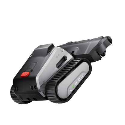 Lymow One Plus robotic mower climbing a steep grass slope — all-terrain caterpillar tracks gripping on incline